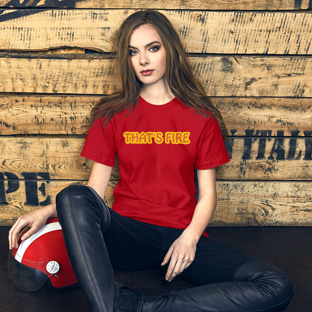 Woman wearing red shirt with That's Fire text on wood background